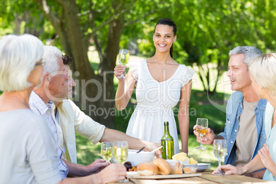 Pretty brunette toasting with her family