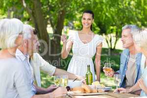 Pretty brunette toasting with her family