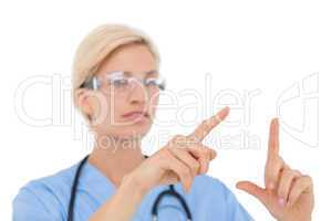Blonde doctor with hands raised