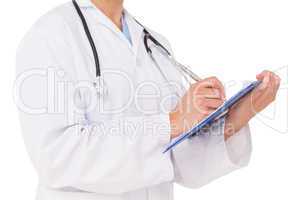 Doctor writing on clipboard