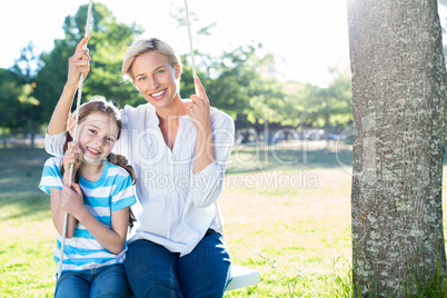 Happy blonde swing with her daughter