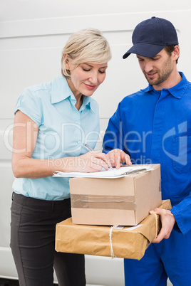 Happy delivery man with customer