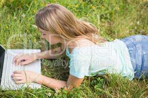 Woman using laptop in park