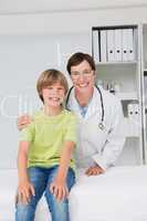 Doctor and young patient smiling to camera