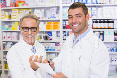 Pharmacist looking a medication for a prescription