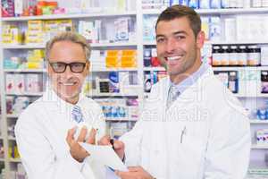 Pharmacist looking a medication for a prescription