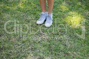 Womans feet standing on grass