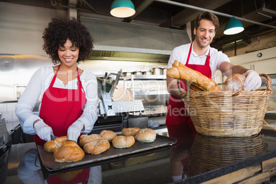 Smiling servers standing behind the counter