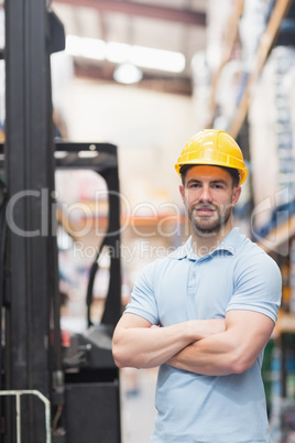 Worker wearing hard hat in warehouse