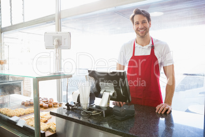 Casual server posing behind the counter