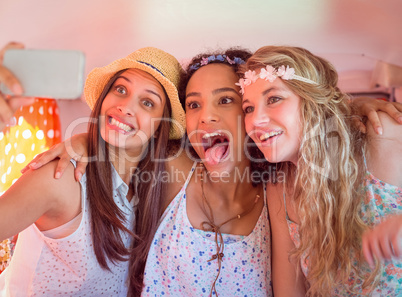 Hipster friends on road trip taking selfie