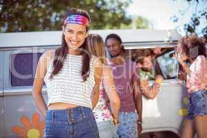 Hipsters hanging out by camper van