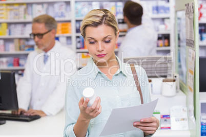 Costumer holding prescription and medicine jar