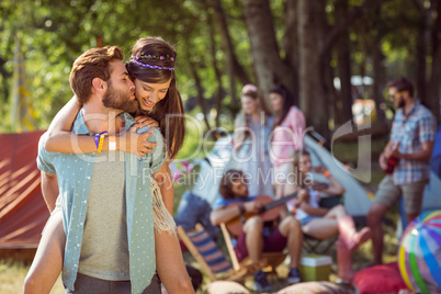 Hipster couple having fun on campsite