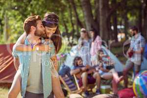 Hipster couple having fun on campsite