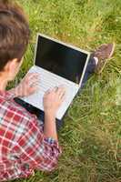 Man with laptop in park