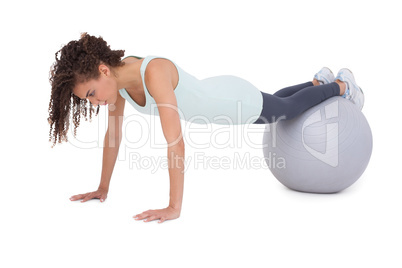 Fit woman wokring out on exercise ball