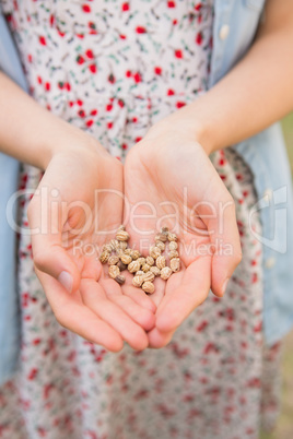 Woman showing hands of grain