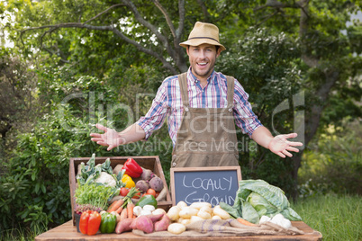 Happy farmer showing his produce