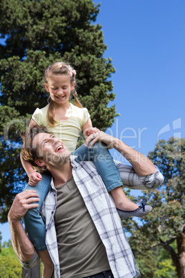 Father and daughter having fun in the park