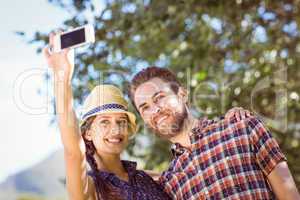 Hipster couple taking a selfie