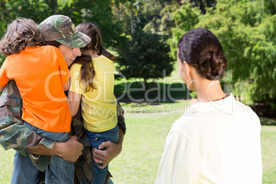 Handsome soldier reunited with family