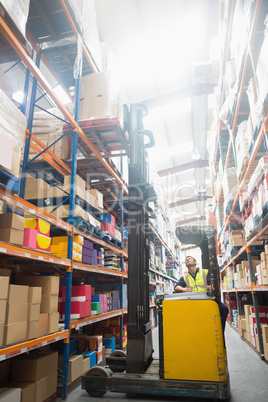 Focused driver operating forklift machine