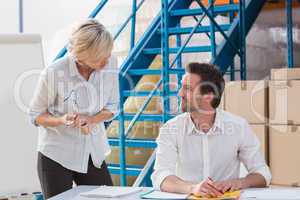 Warehouse managers speaking during a meeting