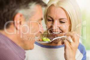 Mature couple preparing meal together