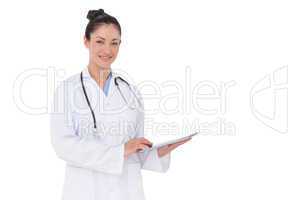 Happy doctor using her tablet pc