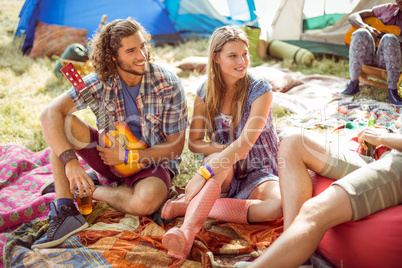 Hipsters having fun in their campsite