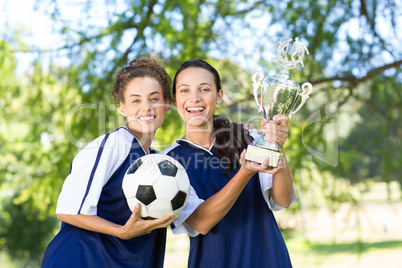 Pretty football players cheering at camera