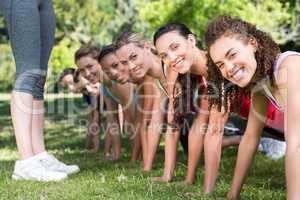 Fitness group planking in park