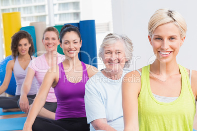 Women practicing yoga during fitness class