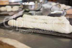 Worktop with dough and bread uncooked