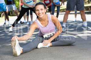 Fit woman warming up before race