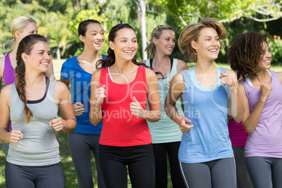 Fitness group jogging in the park