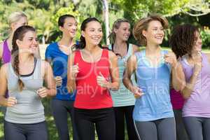 Fitness group jogging in the park