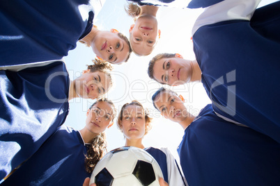 Pretty football players smiling at camera