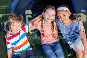 Happy siblings on a camping trip