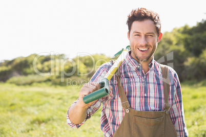 Happy farmer smiling at camera