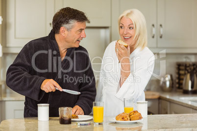 Mature couple having breakfast together