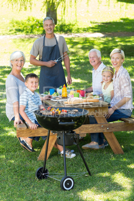 Happy family having picnic in the park