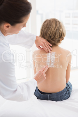 Doctor testing a childs skin