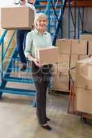 Warehouse managers loading a trolley