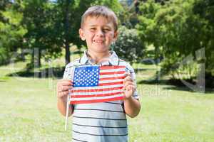 Little boy waving american flag