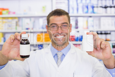 Pharmacist showing medicines jar