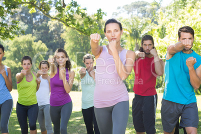 Fitness group working out in park