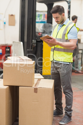 Warehouse worker with clipboard