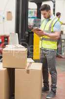 Warehouse worker with clipboard